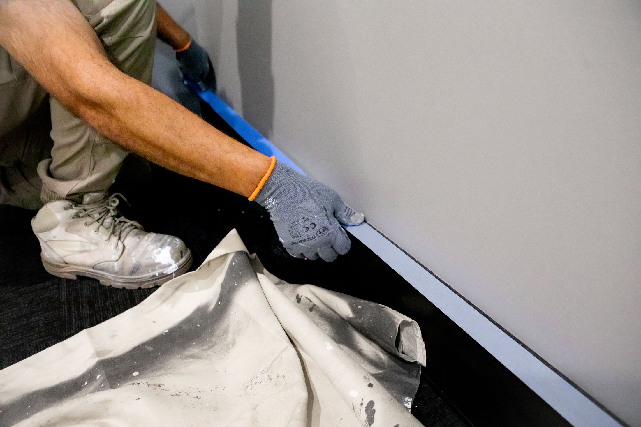 A Next Coat painter preparing a surface
