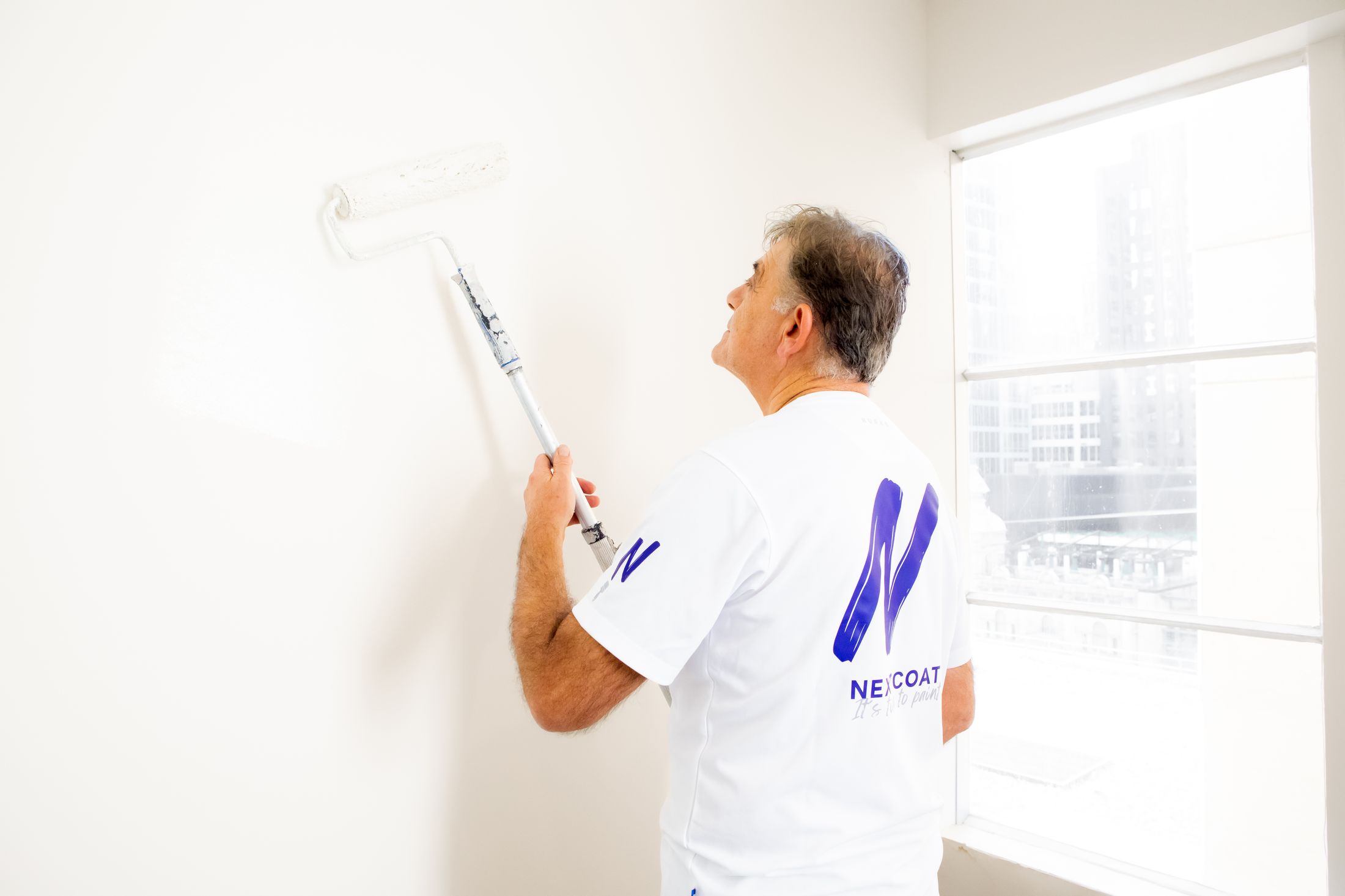 A Next Coat painter at work